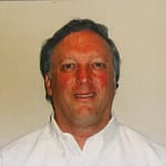 Ken Weinberg, Chiropodist and Foot Specialist (D.Ch.), providing expert foot care and treatment in a clinical setting.